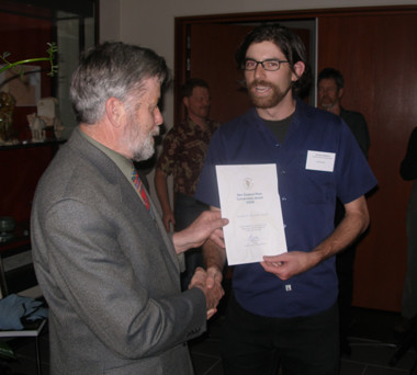 Ian Spellerberg presents the Council award to Jonathan Boow (there on behalf of the Auckland Regional Council).